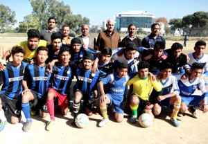 Footballers posing during football tourney being organized by Jammu and Kashmir Mini Football Association. -Excelsior/Rakesh