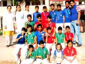 Medal winners of Playway School Pounichak posing for a group photograph.