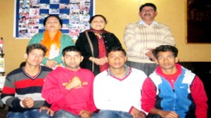 The winners of the medals posing for photographs with Principal and other dignitaries.
