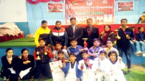 Medal winners in 13th National Martial Arts Championship posing for a group photograph.
