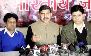 BJP State President Jugal Kishore Sharma talking to reporters at Jammu along with Party spokespersons Sunil Sethi and Balbir Ram Rattan on Tuesday. -Excelsior/Rakesh