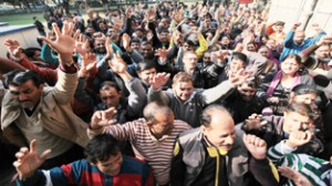 JU Class-IV employees holding a protest demonstration on the campus on Tuesday. -Excelsior/Rakesh