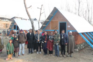 Officials of Zee Entertainment Enterprises Limited along with beneficiaries posing for photograph at Pulwama.  —Excelsior/Younis Khaliq