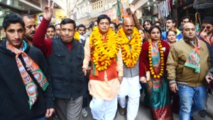 BJP candidate Jammu East, Rajesh Gupta and party secretary, Yudhvir Sethi leading a procession in Jammu on Tuesday.
