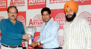 Dignitary presenting award to participant on Monday.