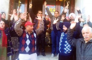Insurance employees staging protest in Jammu on Monday.