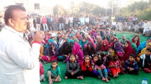 BJP candidate from Vijaypur C.P Ganga addressing election meeting at Patli on Thursday. -Excelsior/ Gautam