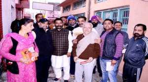 NC candidate from Jammu West, Dharamveer Singh Jamwal, during door to door campaign on Monday.