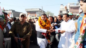 Cong candidate Sham Lal Sharma conducting poll campaign in Akhnoor.
