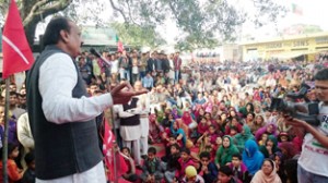 Surjit Singh Slathia addressing election rally at Gurha Slathian on Sunday.