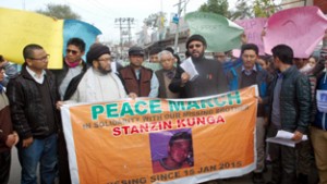 Ladakhi students and senior citizens raising slogans during protest-cum-peace march at Jammu on Saturday.-Excelsior/Rakesh
