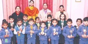 Winners of story telling and English recitation competition posing for a group photograph alongwith staff at DPS Jammu.
