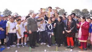 Principal, Heritage School, Jagdish Singh Dhami, awarding trophy to a meritorious student during Annual Athletic Meet, at Jammu on Saturday.