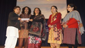 Principal, GCW Gandhi Nagar, Dr Kiran Bakshi, awarding winner of Intra College Symposia at Jammu on Saturday.
