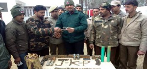 Security personnel with seized arms and explosives in Surankote on Tuesday. —Excelsior/Harbhajan
