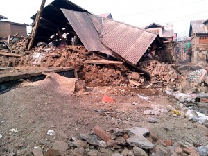 A collapsed house at New Colony in Batmaloo area of  Srinagar.