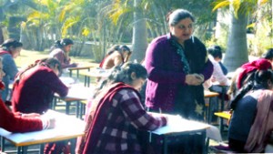 Students busy in making paintings during a competition at Calliope College of Education, Doomi in Jammu on Monday. 