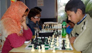 Players in action during chess matches at Jammu on Monday.