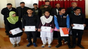 Winners of creative writing and declamation competition displaying certificates while posing for group photograph at Mendhar on Saturday.