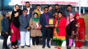 KU cultural team posing for a group photograph along with dignitaries after excelling in Youth Festival.