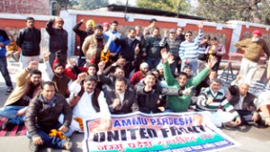 Activists of Jammu Pradesh United Front staging protest dharna outside Raj Bhawan in Jammu on Thursday. -Excelsior/Rakesh