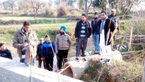 MLA R S Pura, Dr Gagan Bhagat along with Revenue officers demarcating water bodies in his constituency on Thursday.