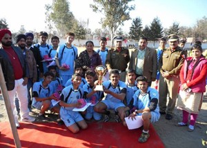 Football team of GHSS Nowshera posing for a group photograph after winning the final.