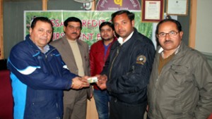 PNB official giving a credit card to a farmer during KCC Mela at Shamachak in Jammu.