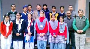 Winners of quiz competition posing for group photograph at Reasi on Wednesday.