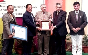 Vice Chancellor Panjab University presenting award to Principal MIET, Jammu. 