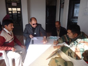 Doctors examining patients during Free Medical Camp organized by Army in Bhaderwah.