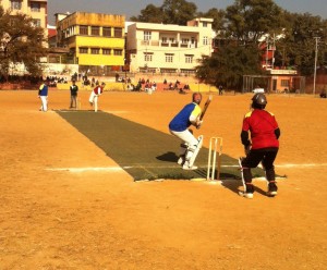 Players in action during a match at Parade cricket ground.