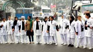 Nursing students of AMT School, GMCH Jammu blocking road at Bakshi Nagar. -Excelsior/ Rakesh