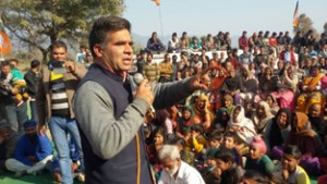 MLA Ravinder Raina addressing a public rally at Nowshera on Friday.— Excelsior/Bhat