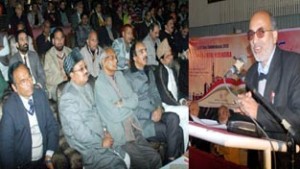 A poet reciting his poetry at the All India Urdu Mushaira at Jammu Club Auditorium on Wednesday. - Excelsior/Rakesh