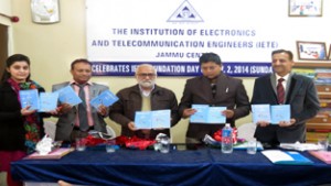 RSS State general secretary Parshotam Dadeechi and MLA Rajesh Gupta releasing books during a function by CART Bharat at Jammu on Sunday.