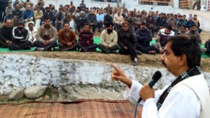MLA Udhampur Pawan Gupta addressing public meeting at Garhi near Udhampur on Sunday.