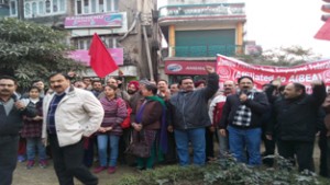 Bank employees staging protest at Shalamar Chowk in Jammu on Tuesday.