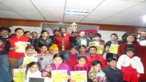 Winners of 7th Season of Pandit Uma Dutt Sangeet Mahotsav posing for a group photograph alongwith the dignitaries in Jammu on Friday.