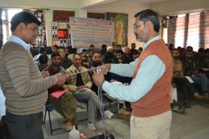 A resource person explaining an activity during workshop on Monday.