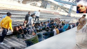 Protesting Railway employees staging a dharna on track at Katra Rly Station on Friday. (Inset picture of the unidentified woman who was found dead from DMU coach) Photo/ Vasu Gupta