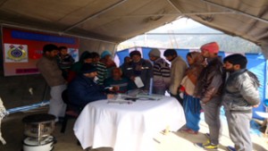 Doctor examining patient during medical camp at village Dranga in tehsil Bhaderwah. -Excelsior/Tilak Raj