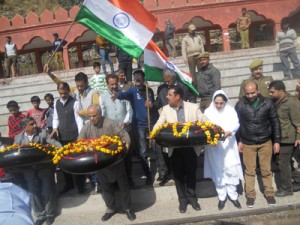 BJP leaders Ashok Koul, Dr Darakhshan Andrabi and MLAs Rajiv Sharma and Dr Krishan Lal releasing burning candles and flowers with message of love & peace for Pakistan, in river Chenab at Akhnoor on Saturday.      -Excelsior/Rakesh