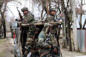 Troops in action during encounter with militants at Thakgund, Rafiabad on Saturday.    —Excelsior/Aabid Nabi 