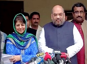 BJP president Amit Shah and PDP chief Mehbooba Mufti jointly address the media in New Delhi on Tuesday.