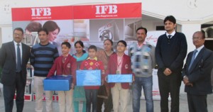 Winners of the painting competition displaying prizes while posing for a group photograph along with the dignitaries at MV International School, Bari Brahamana in Samba.