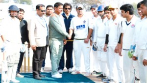 Subash Chander, Sarpanch Mandal and Ankush Abrol, Working Committee Member JKCA interacting with players while inaugurating Holi Cup at Mandal ground in Jammu on Wednesday.