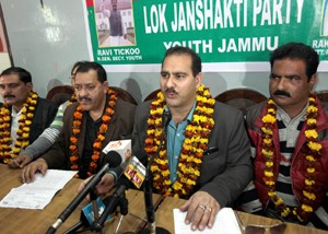 Sanjay Saraf interacting with media persons at Jammu on Monday. -Excelsior/Rakesh