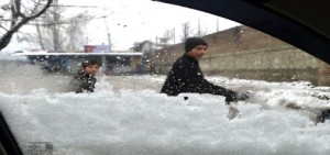 A view of snowfall and rains at Rafiabad, Sopore on Wednesday. —Excelsior/Aabid Nabi