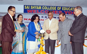 MLA Sukhnandan Choudhary and other dignitaries lighting ceremonial lamp while inaugurating Seminar at Sai Shyam College of Education at Ghou-Manhasan in Jammu.
